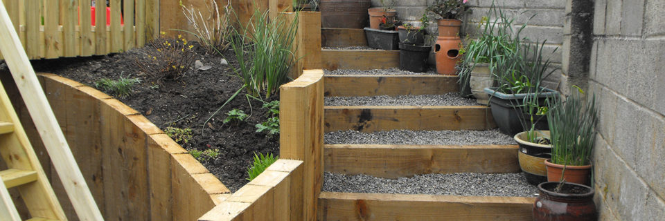 Planting to soften hard lines of retaining areas